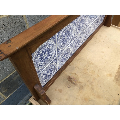 8 - An Edwardian satinwood washstand with a blue and white tiled gallery back 107x46x66