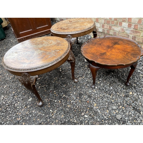 111 - A pair of circular reproduction mahogany occasional tables together with a pie crust table