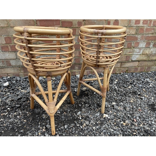 112 - A pair of vintage wickerware plant stands