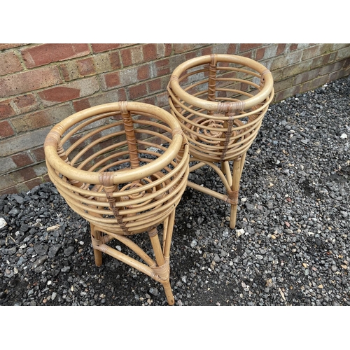112 - A pair of vintage wickerware plant stands