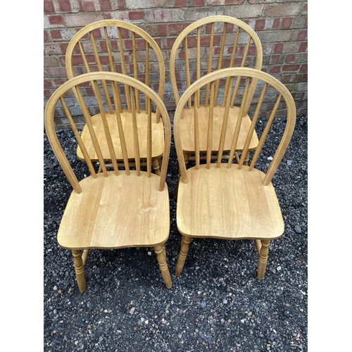 113 - A set of four modern beechwood Stickback chairs