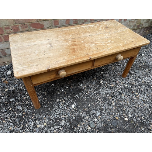 115 - A low pine two drawer coffee table