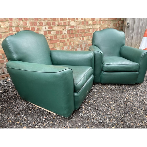 119 - A pair of early 20th century club style armchairs with deep seats and loose cushion, upholstered in ... 