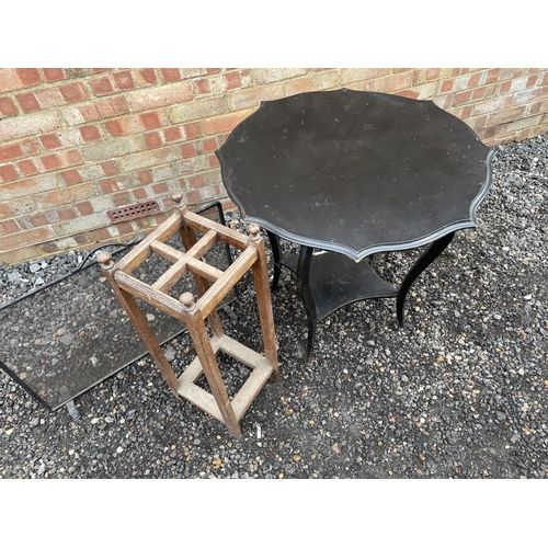 125 - A black occasional table together with a oak stickstand and a fire guard