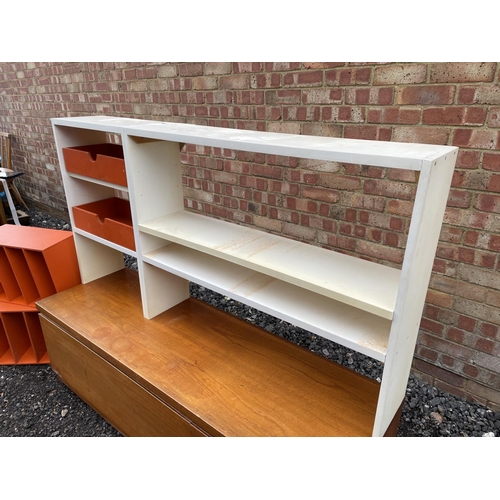 128 - A mid century modular wall unit by White and newton. Teak base fitted with white shelving housing or... 