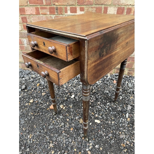 137 - A Victorian mahogany drop leaf work table fitted with two drawers and two dummy drawers