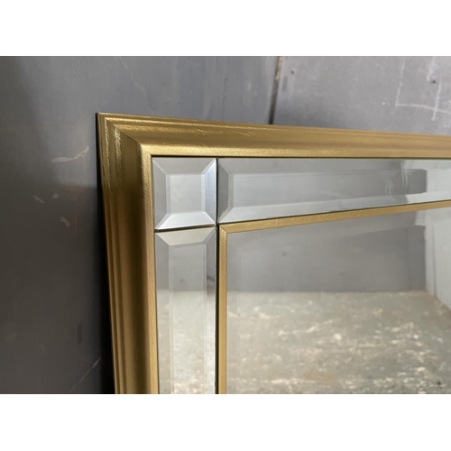 14 - A large bevelled overmantle mirror 105x74