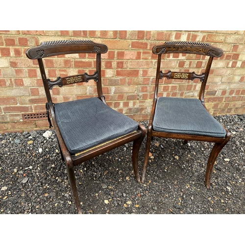 142 - A pair of Mahogany chairs with brass inlay