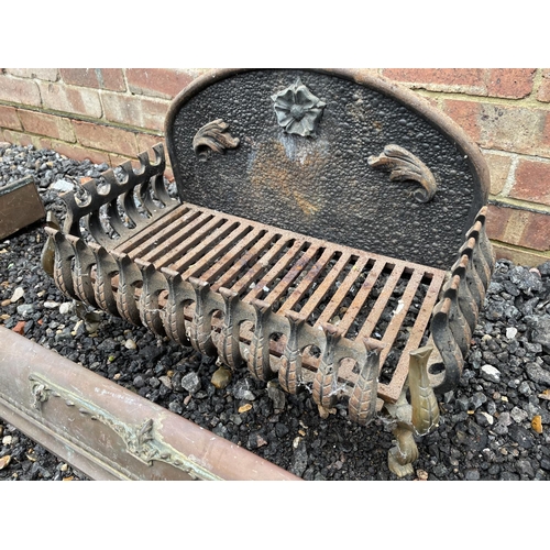 145 - An iron fire basket together with a brass fender