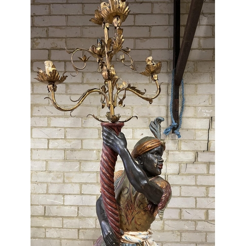 160 - A gilt blackamoor statue lamp on a pedestal 205cm total height