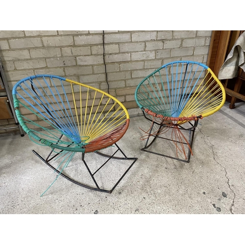 167 - A pair of 1970's string seat rocking chairs
