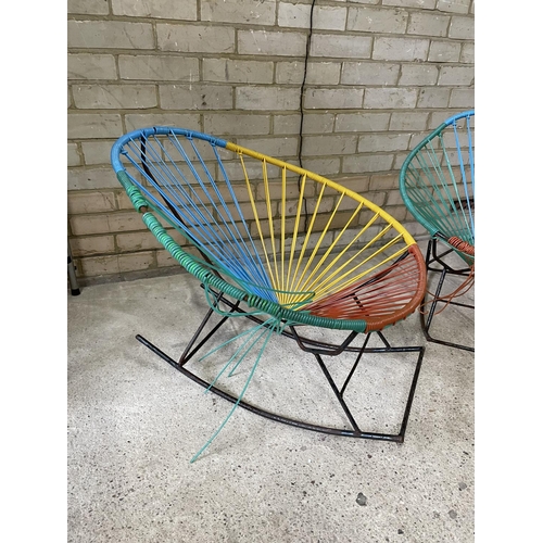 167 - A pair of 1970's string seat rocking chairs
