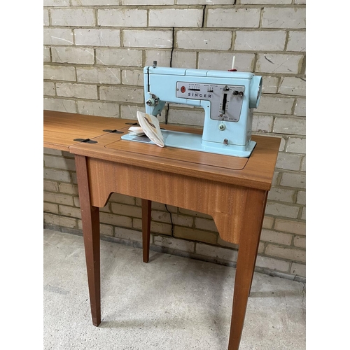 168 - A teak cased singer sewing machine