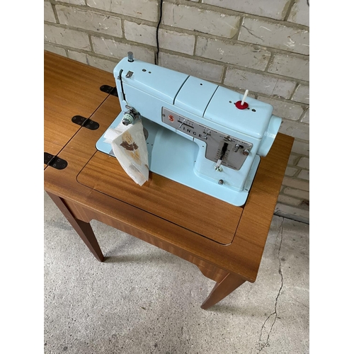 168 - A teak cased singer sewing machine