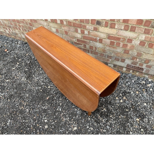 196 - A mid century teak drop leaf table