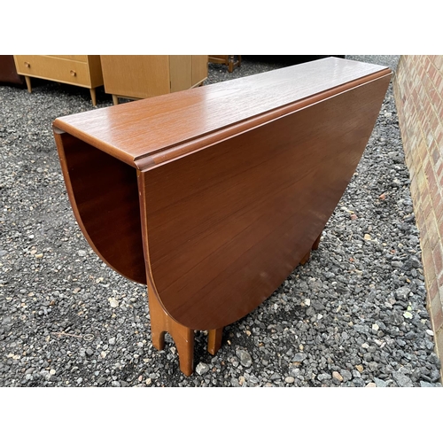 196 - A mid century teak drop leaf table