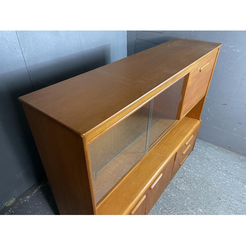 20 - A mid century teak cocktail sideboard with glazed cabinet and drop down drinks compartments 150x40x1... 