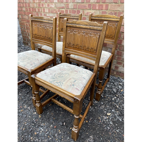 200 - A set of four chairs by old charm with linenfold pattern back