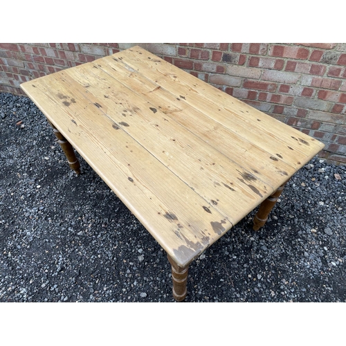 201 - An antique pine kitchen table with a single drawer