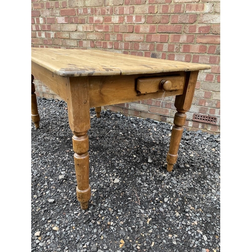 201 - An antique pine kitchen table with a single drawer