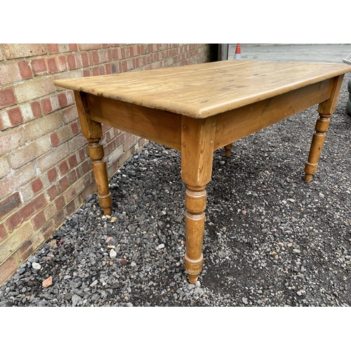 201 - An antique pine kitchen table with a single drawer