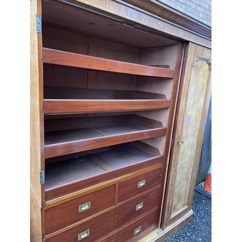 202 - A large Victorian mahogany triple Compactum wardrobe fitted with four slides and four drawers 174x58... 