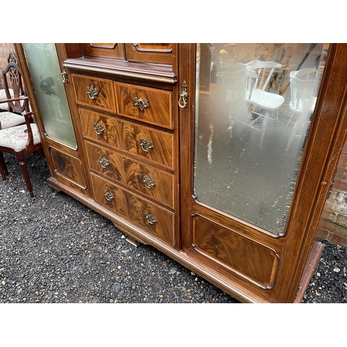 203 - A Mahogany triple Compactum wardrobe  inlaid with satinwood. 199x56x215