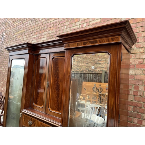 203 - A Mahogany triple Compactum wardrobe  inlaid with satinwood. 199x56x215