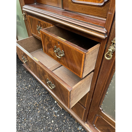 203 - A Mahogany triple Compactum wardrobe  inlaid with satinwood. 199x56x215