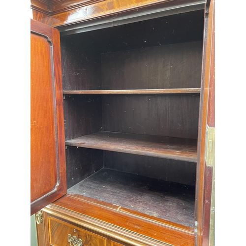 203 - A Mahogany triple Compactum wardrobe  inlaid with satinwood. 199x56x215