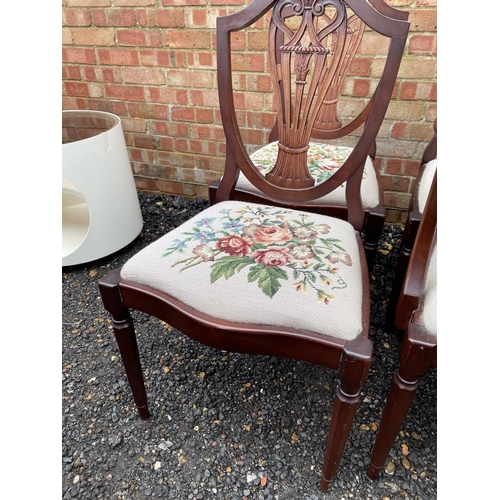 204 - A set of 8 reproduction mahogany dining chairs with floral decorative seats