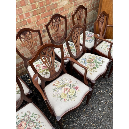 204 - A set of 8 reproduction mahogany dining chairs with floral decorative seats