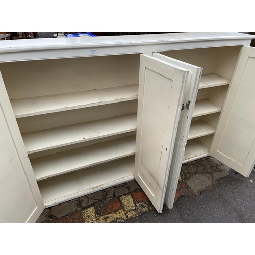 205 - A white painted four door house keepers laundry cupboard 213x31x132