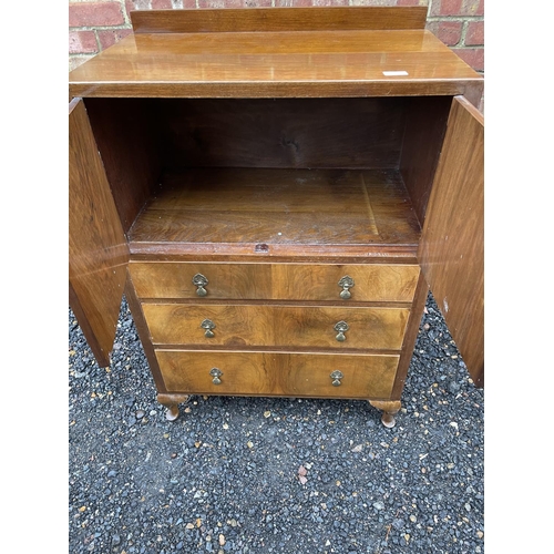 206 - A early 20th century gentlemans wardrobe, cupboard over three drawers