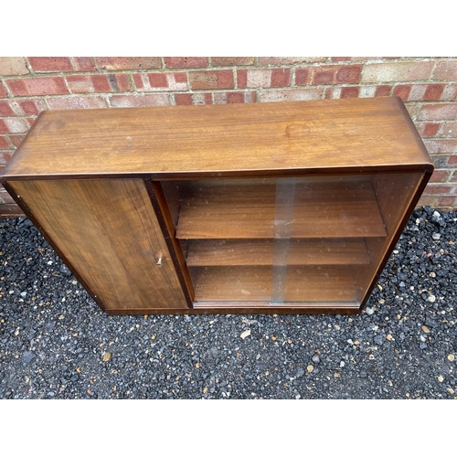 209 - A mid century side by side bookcase cupboard by goodman