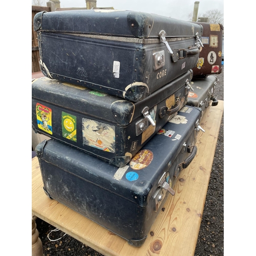 213 - A collection of five vintage cases all covered in 1960's / 70's traveling stickers