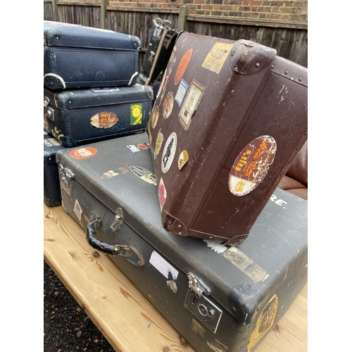 213 - A collection of five vintage cases all covered in 1960's / 70's traveling stickers