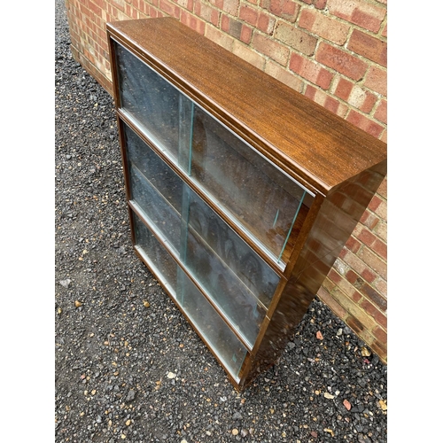 236 - A 20th century three section oak bookcase