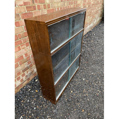 236 - A 20th century three section oak bookcase