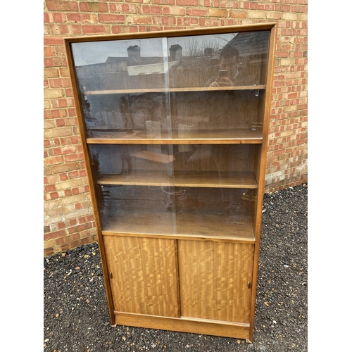 237 - A mid century glazed teak bookcase by Gibbs