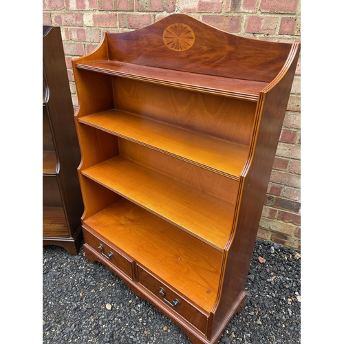 242 - A yew waterfall front bookcase together with a mahogany open fromted bookcase