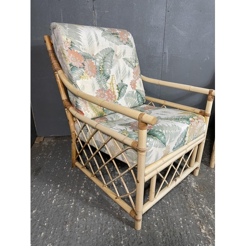 25 - A pair of bamboo armchairs with tropical theme cushion seats