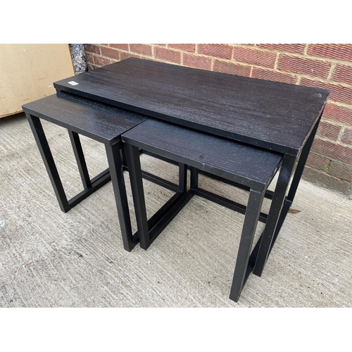 257 - A modern black nest of three tables