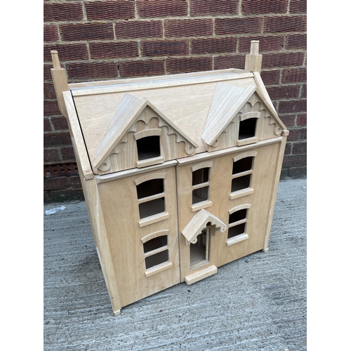 259 - A modern beechwood dolls house with lift up top, supplies by Harrods 62x66