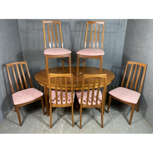 26 - A g Plan style extending teak oval dining table together with six chairs