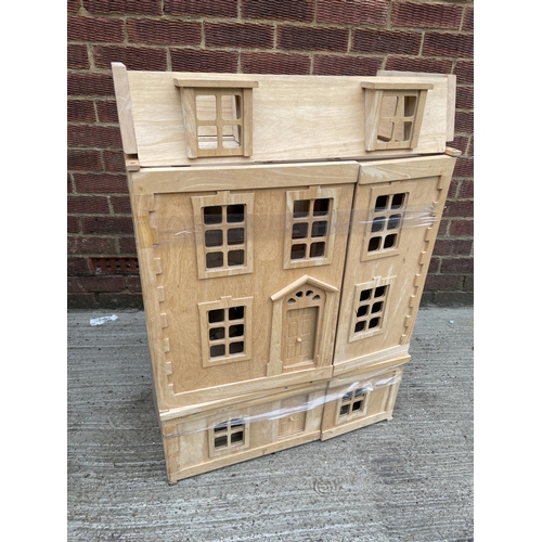 260 - A modern beechwood dolls house with fitted interior supplies by Harrods 64x90