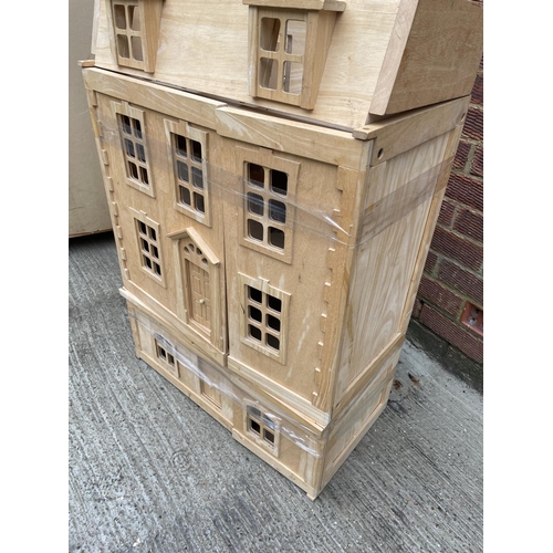 260 - A modern beechwood dolls house with fitted interior supplies by Harrods 64x90