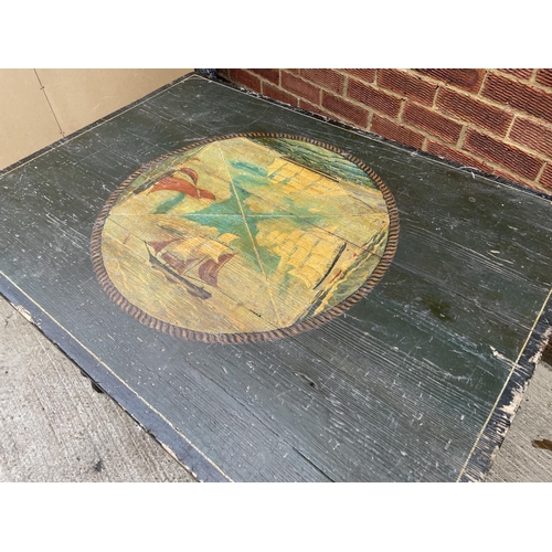 263 - A green painted pine table decorated with ship scenes