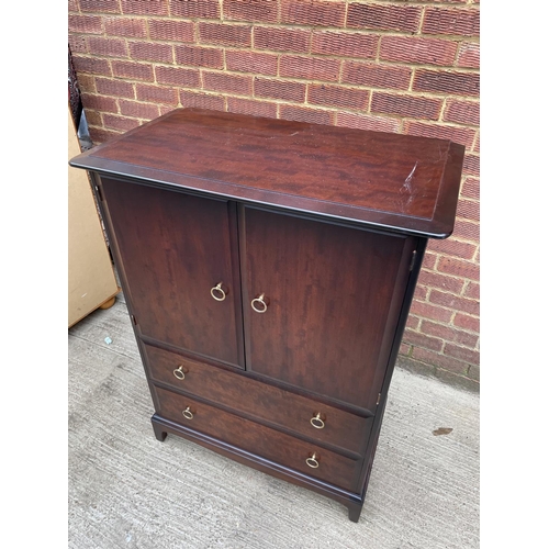 265 - A stag minstrel mahogany gents chest, cupboard over two drawers