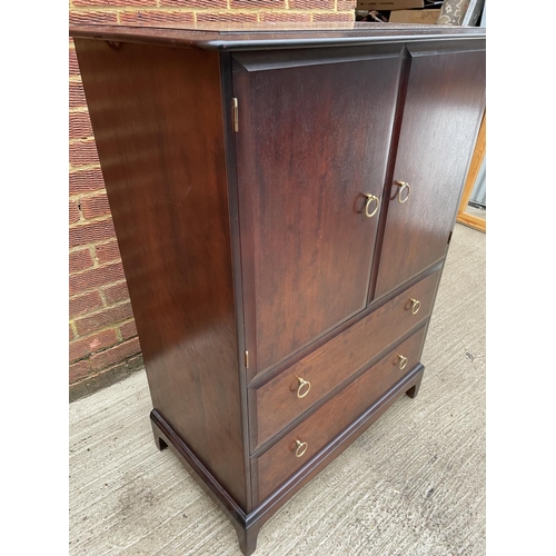 265 - A stag minstrel mahogany gents chest, cupboard over two drawers